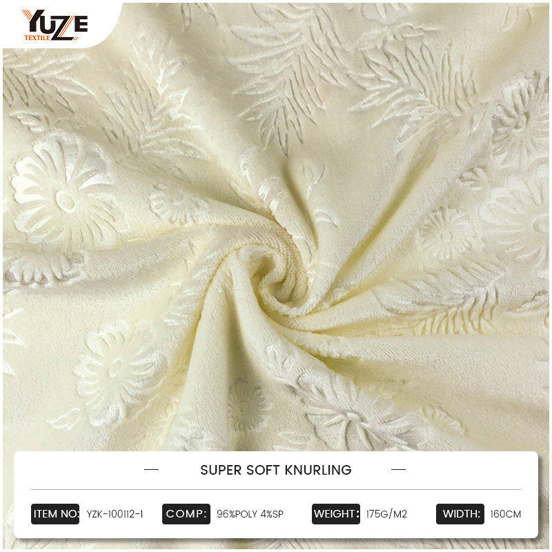 Hur är präglat tyg transformerande mode, inredning och textilinnovation?